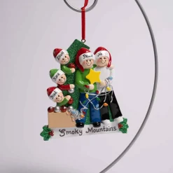 Family Of 5 Decorating Tree