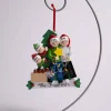 Family Of 4 Decorating Tree