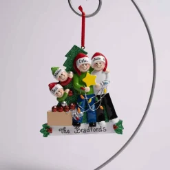 Family Of 4 Decorating Tree